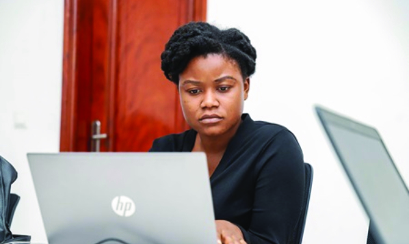 Woman looking at laptop screen